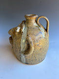 # 12Terry King Face Jug Buggy Jug 7"