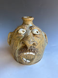 # 12Terry King Face Jug Buggy Jug 7"