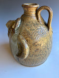 # 13 Terry King Face Jug Buggy Jug 7"